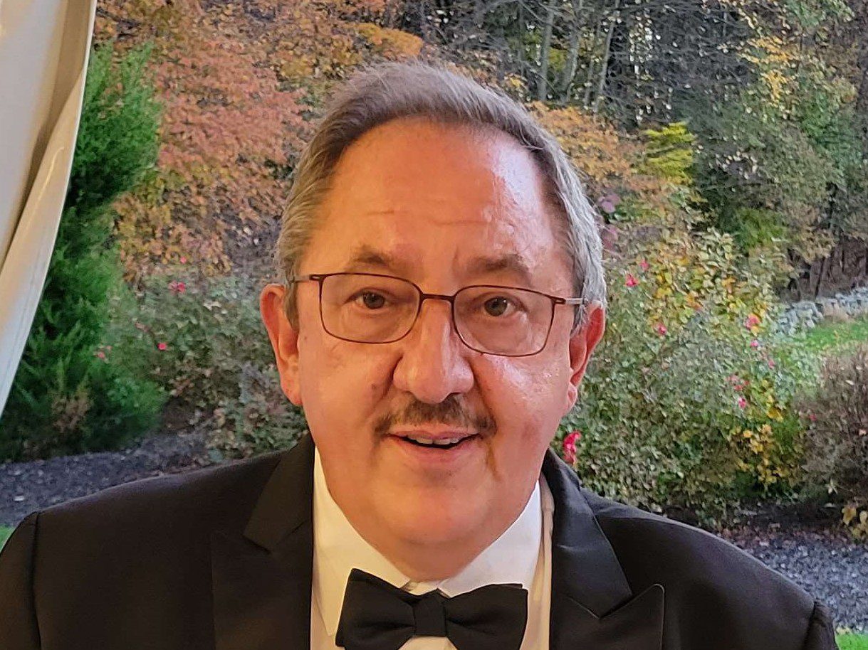 Mauro Coletti in a Suit and Bow Tie